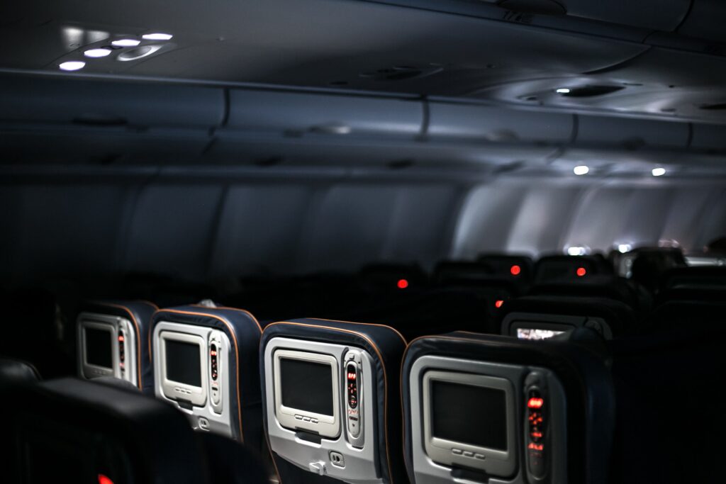 A plane's interior, with empty seats.